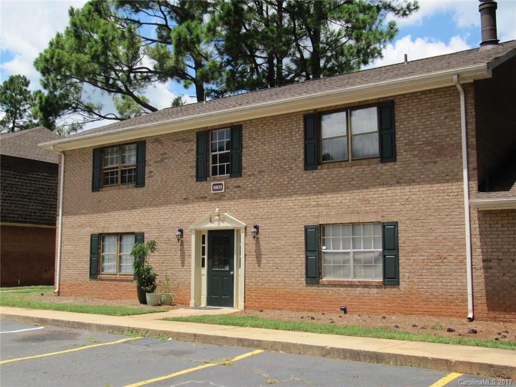 5803 Hunting Ridge Lane, Unit B Charlotte, NC 28212 - Photo 2 of 15 a front view of a house with a yard and garage