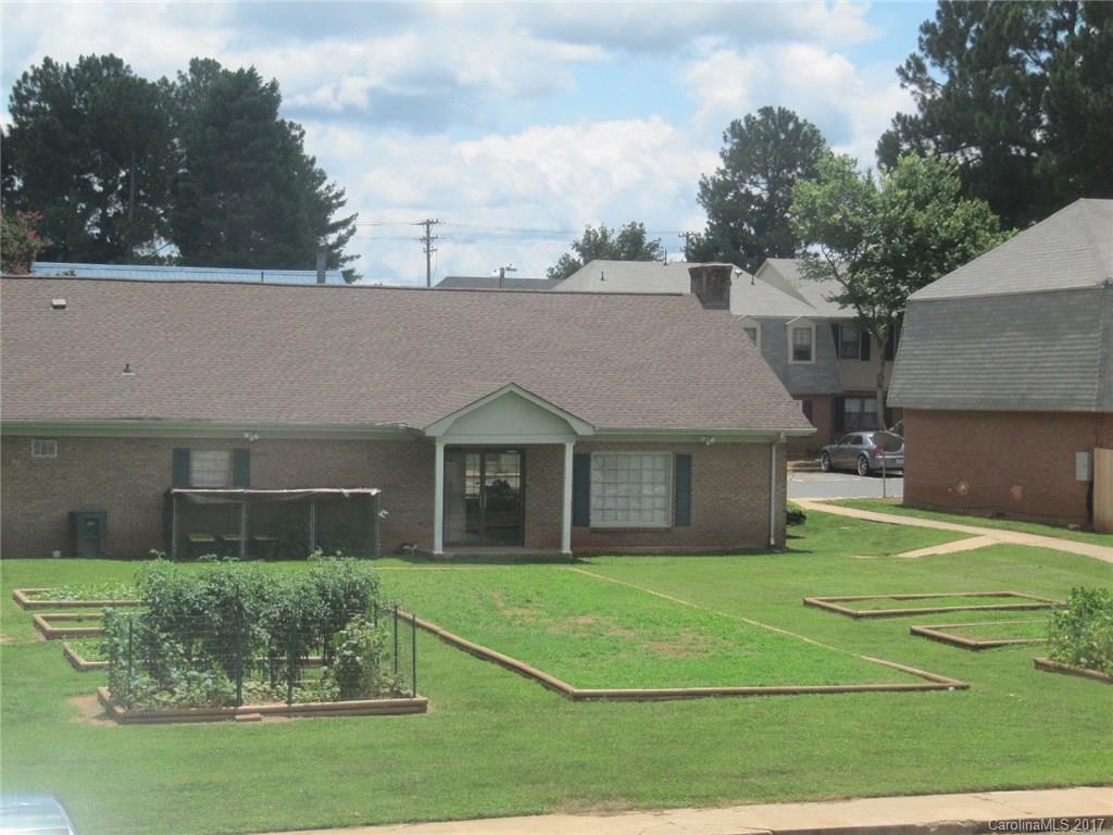 5803 Hunting Ridge Lane, Unit B Charlotte, NC 28212 - Photo 12 of 15 a view of a house with a yard