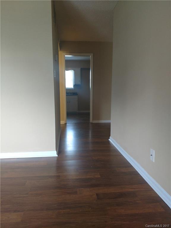 5803 Hunting Ridge Lane, Unit B Charlotte, NC 28212 - Photo 6 of 15 a view of a hallway with wooden floor