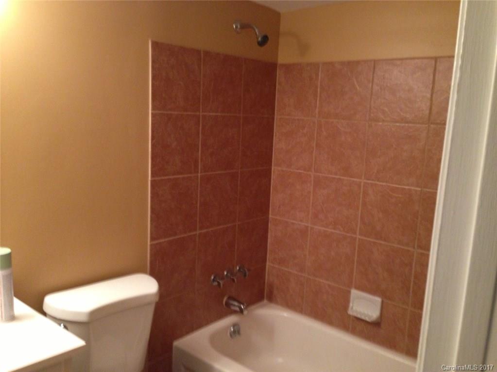 5803 Hunting Ridge Lane, Unit B Charlotte, NC 28212 - Photo 8 of 15 a bathroom with a toilet and a sink