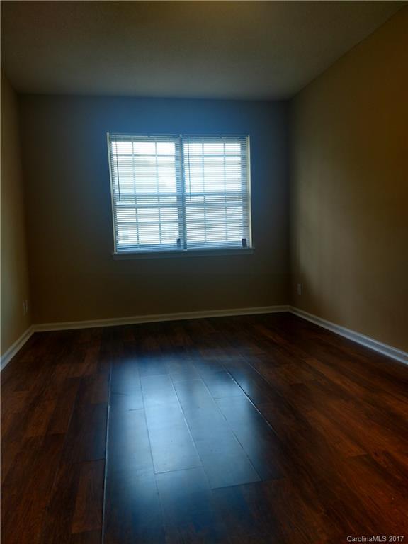 5803 Hunting Ridge Lane, Unit B Charlotte, NC 28212 - Photo 9 of 15 a view of room with hardwood floor and window
