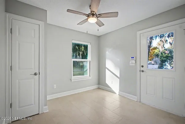 a view of an empty room with a window