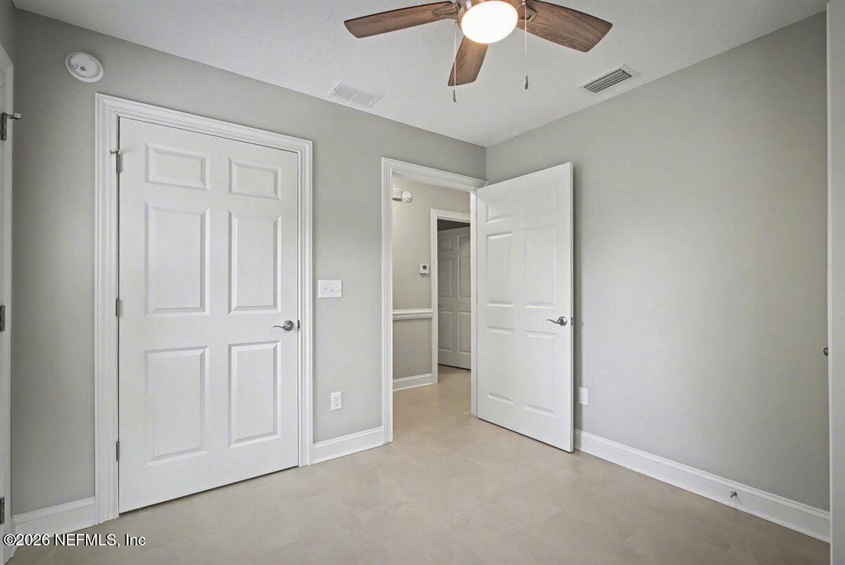 2210 Shepard Street Jacksonville, FL 32211 - Photo 20 of 29 an empty space with closet and a ceiling fan