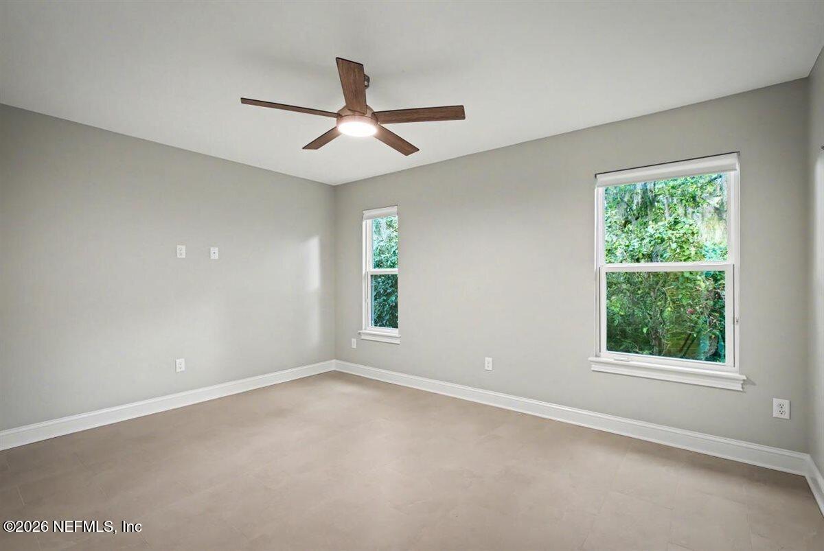 2210 Shepard Street Jacksonville, FL 32211 - Photo 21 of 29 an empty room with a window and a fan