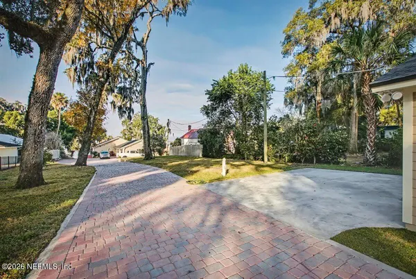 a view of a playground with basketball court