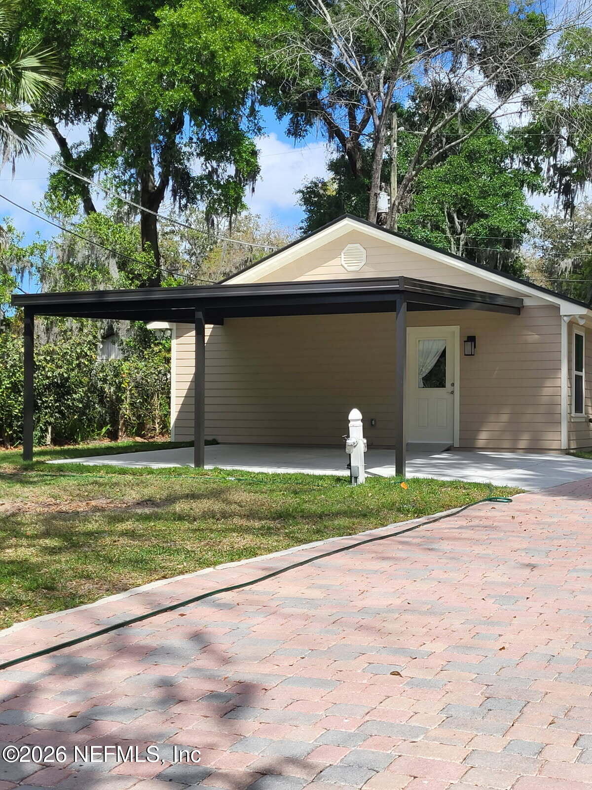 2210 Shepard Street Jacksonville, FL 32211 - Photo 8 of 29 a front view of a house with a yard and potted plants