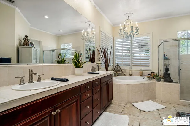 a spacious bathroom with sinks mirror and a bathtub
