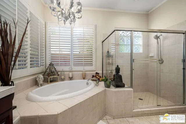 a bathroom with a sink a mirror and a shower