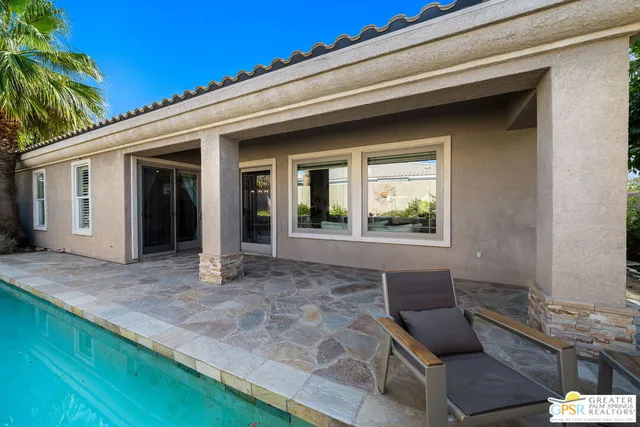 a view of house with outdoor seating space