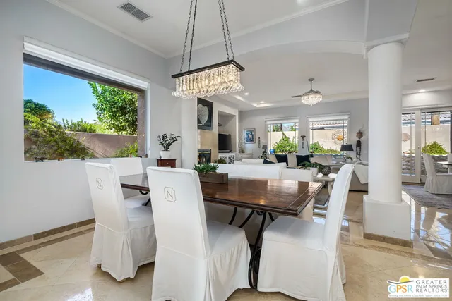 a view of a dining room with furniture window and outside view