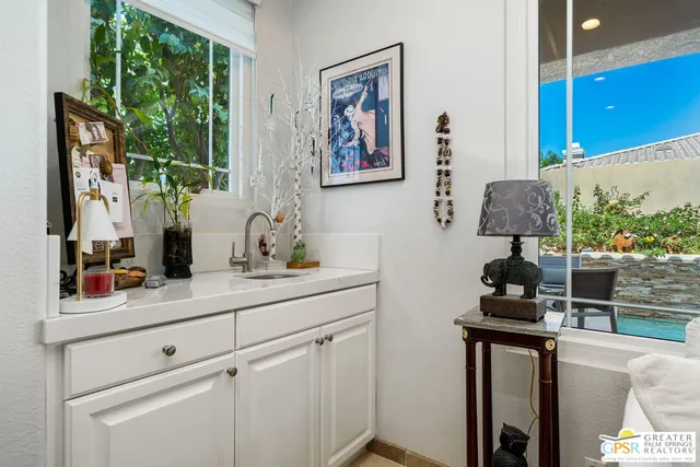 a sink sitting next to a window