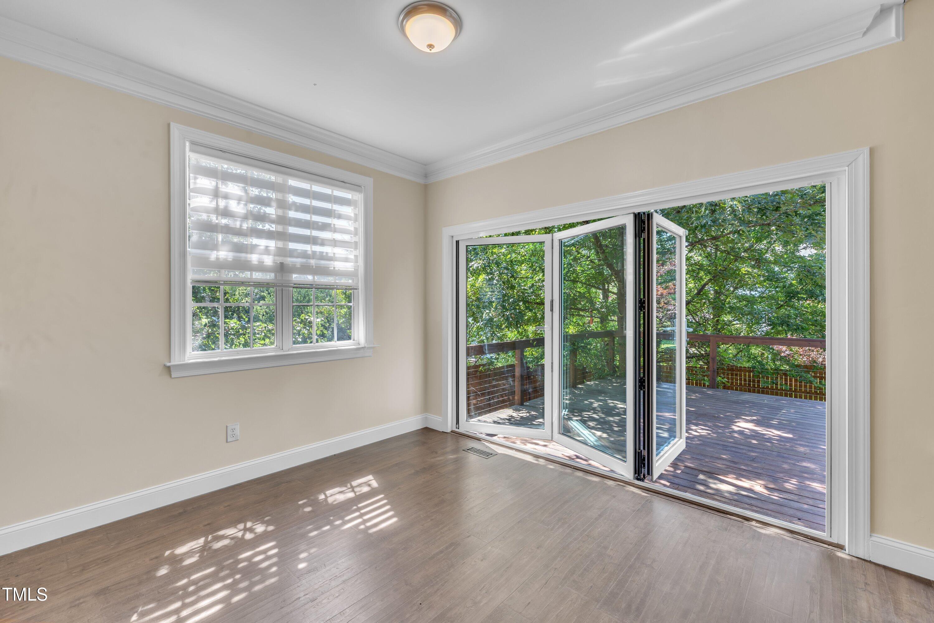 1400 Crete Drive Raleigh, NC 27606 - Photo 12 of 56 a view of a big room with wooden floor and windows