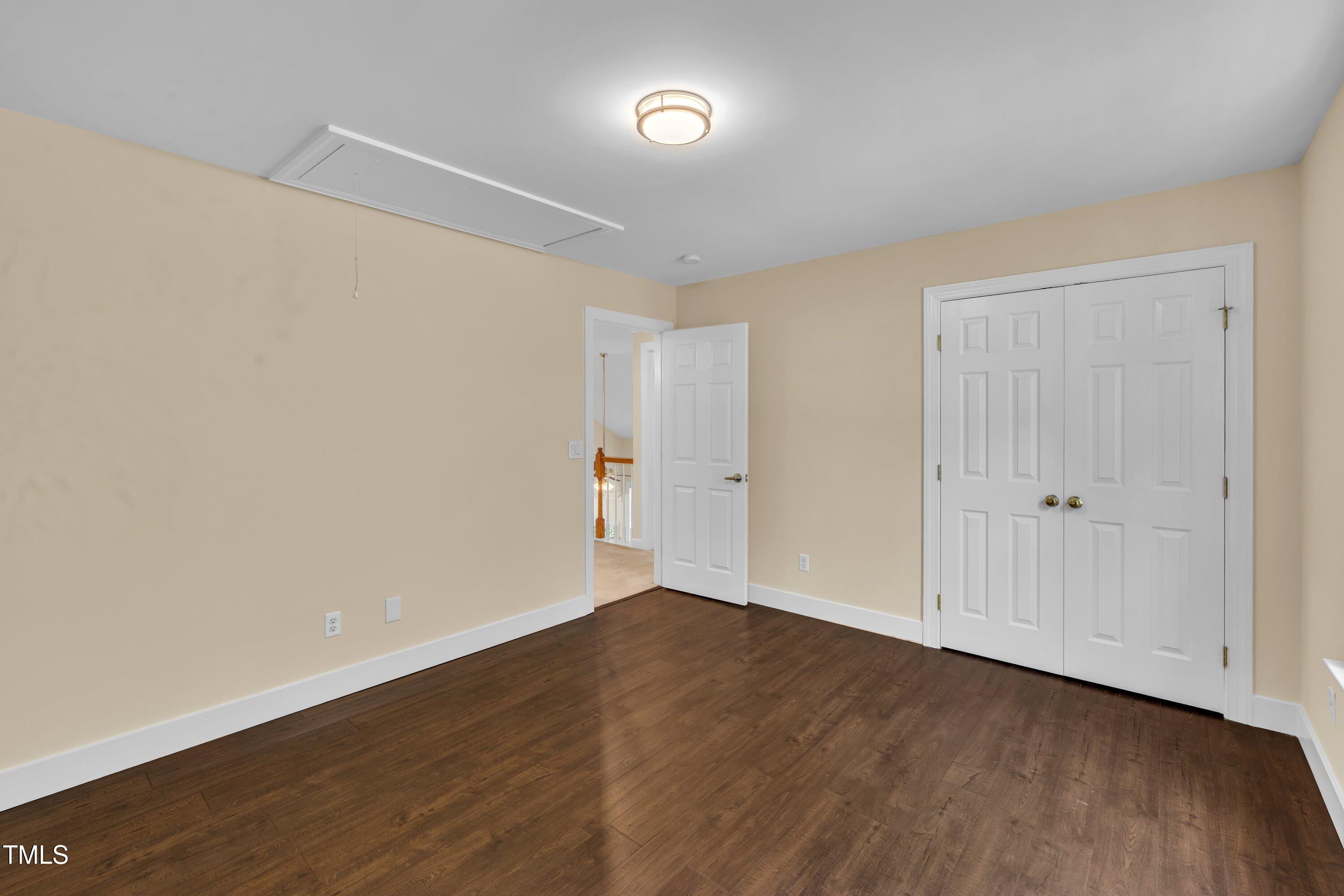 1400 Crete Drive Raleigh, NC 27606 - Photo 36 of 56 a view of an empty room with wooden floor