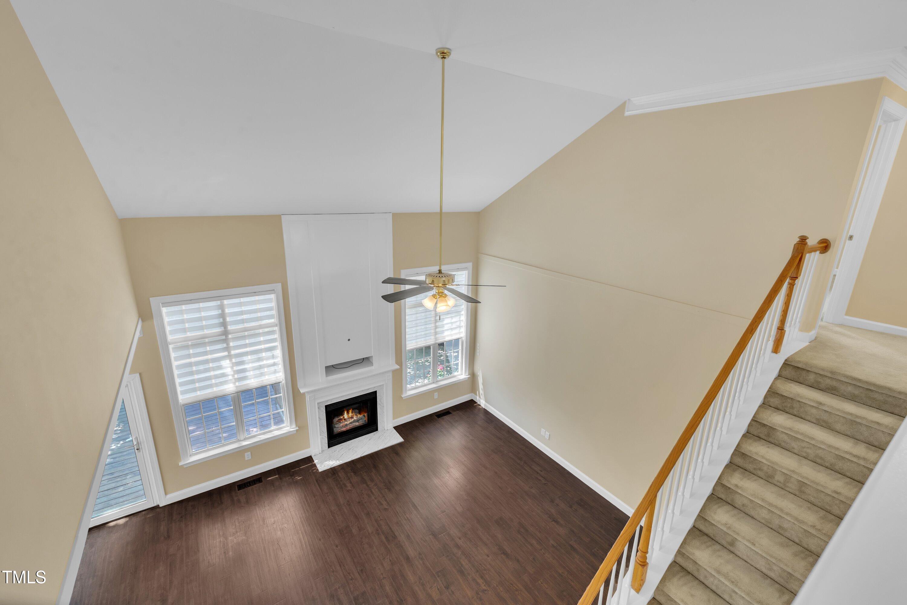 1400 Crete Drive Raleigh, NC 27606 - Photo 37 of 56 a view of a livingroom with wooden floor and stairs