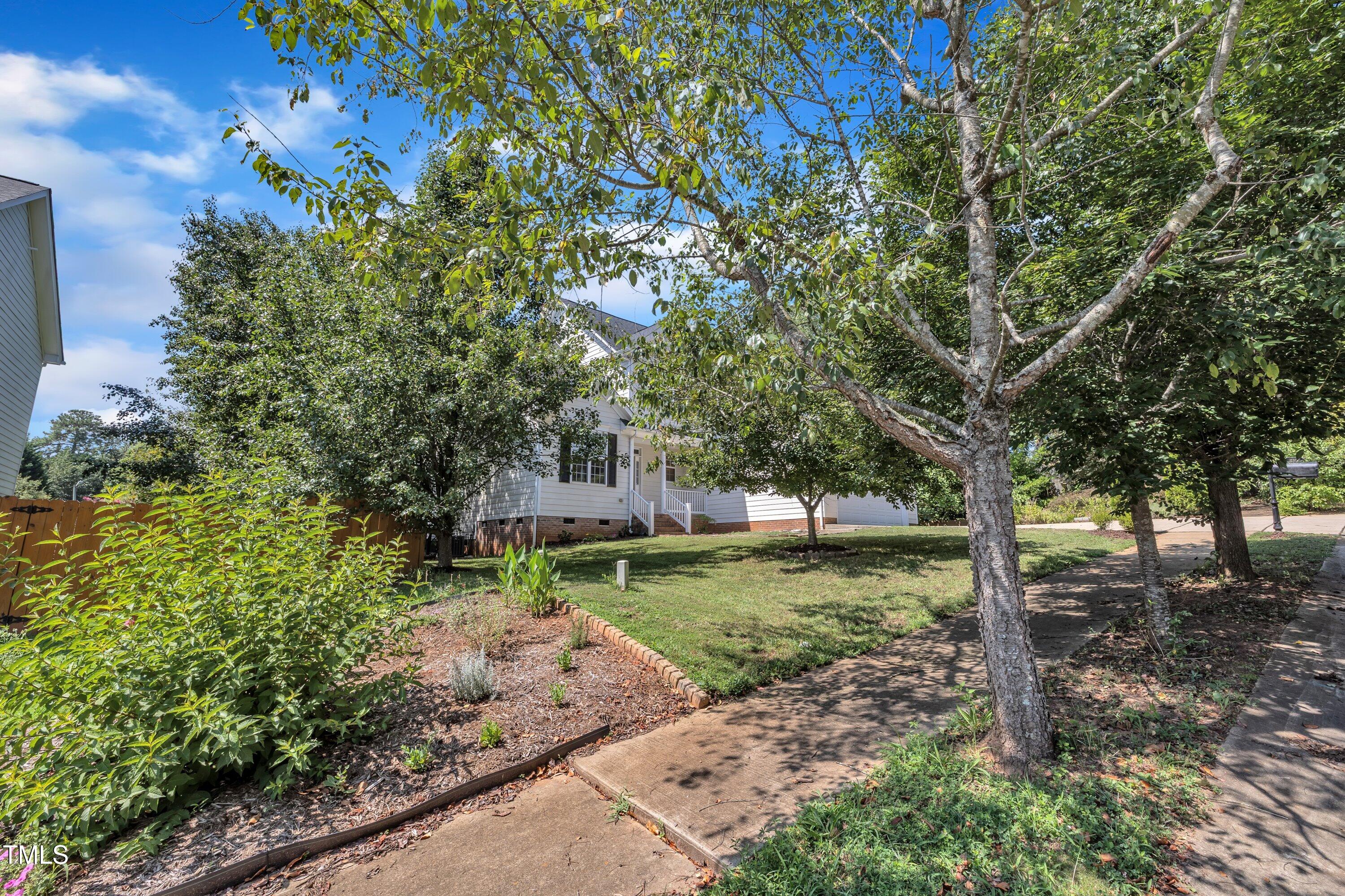 1400 Crete Drive Raleigh, NC 27606 - Photo 55 of 56 a backyard of a house with lots of green space