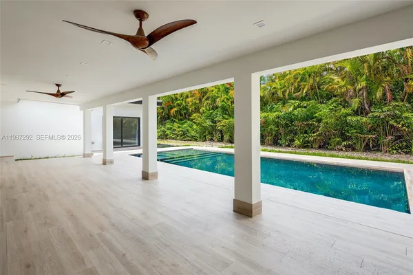 a view of a patio with a yard