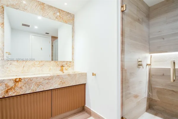 a bathroom with a sink and a mirror