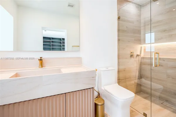 a bathroom with a sink and toilet