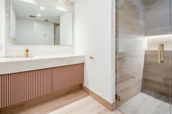 a bathroom with a sink and a mirror
