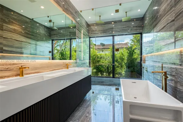 a bathroom with a sink and a large window