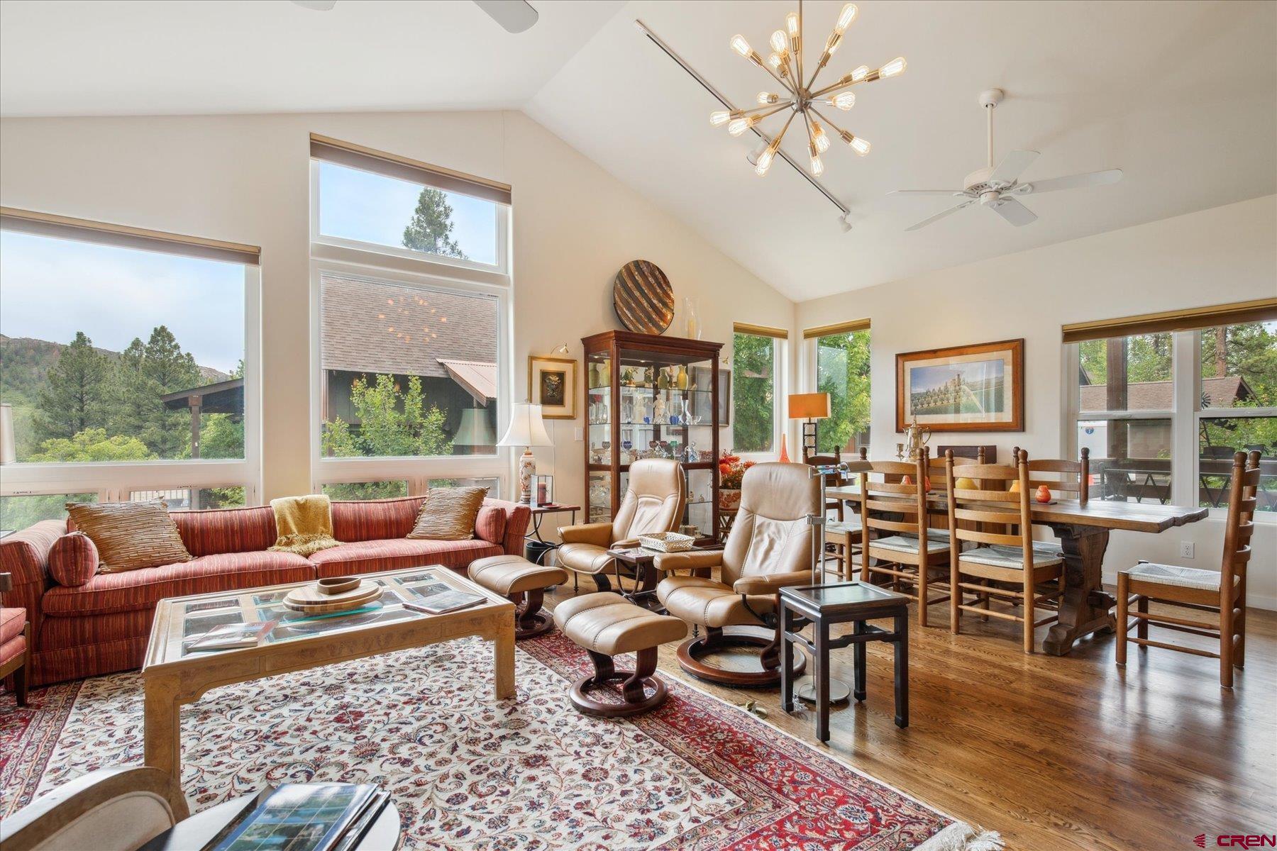 152 Red Canyon Trail, Unit R Durango, CO 81301 - Photo 11 of 42 a living room with lots of furniture wooden floor and a large window