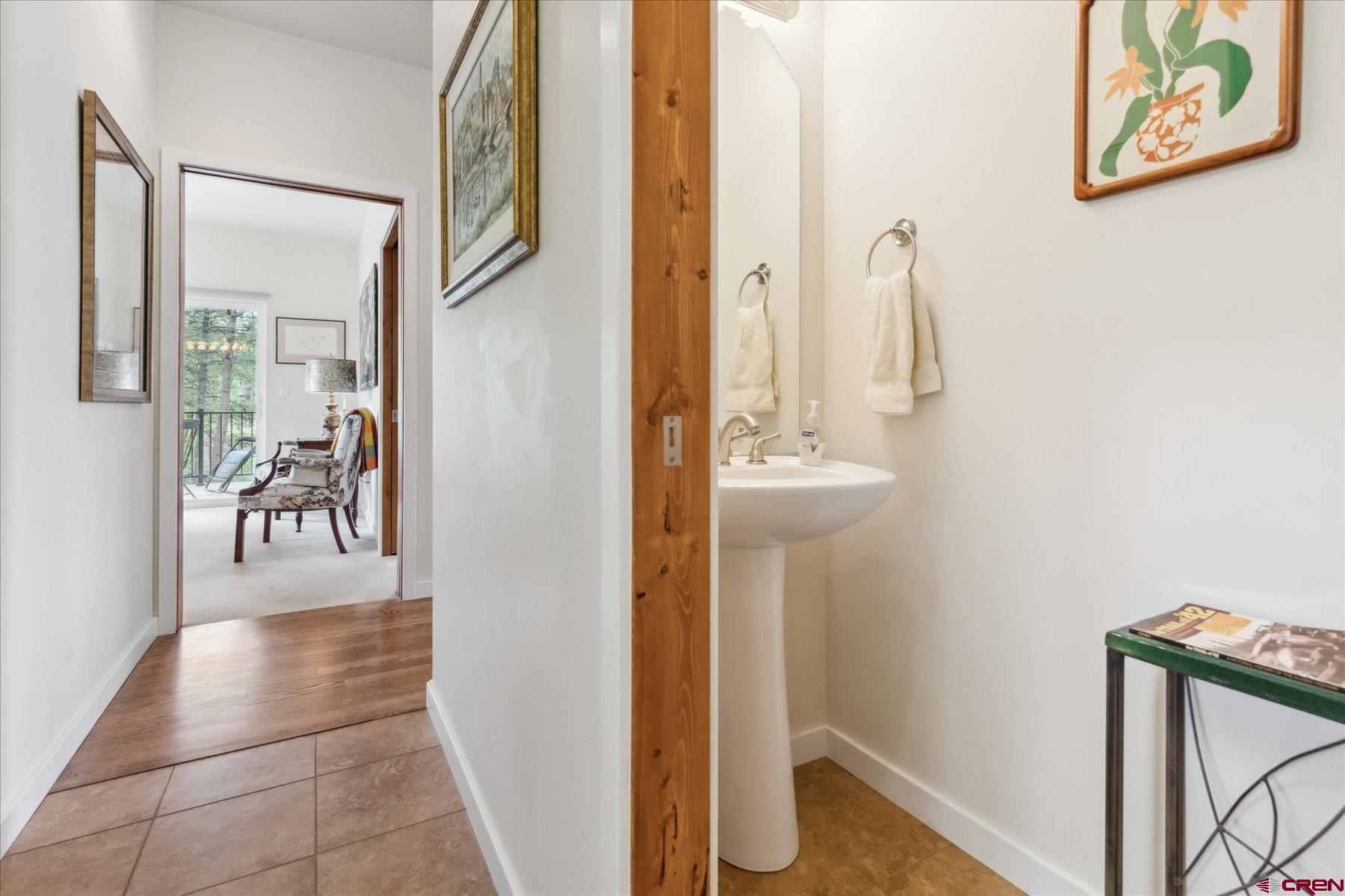 152 Red Canyon Trail, Unit R Durango, CO 81301 - Photo 15 of 42 a view of a hallway with wooden floor and dining room