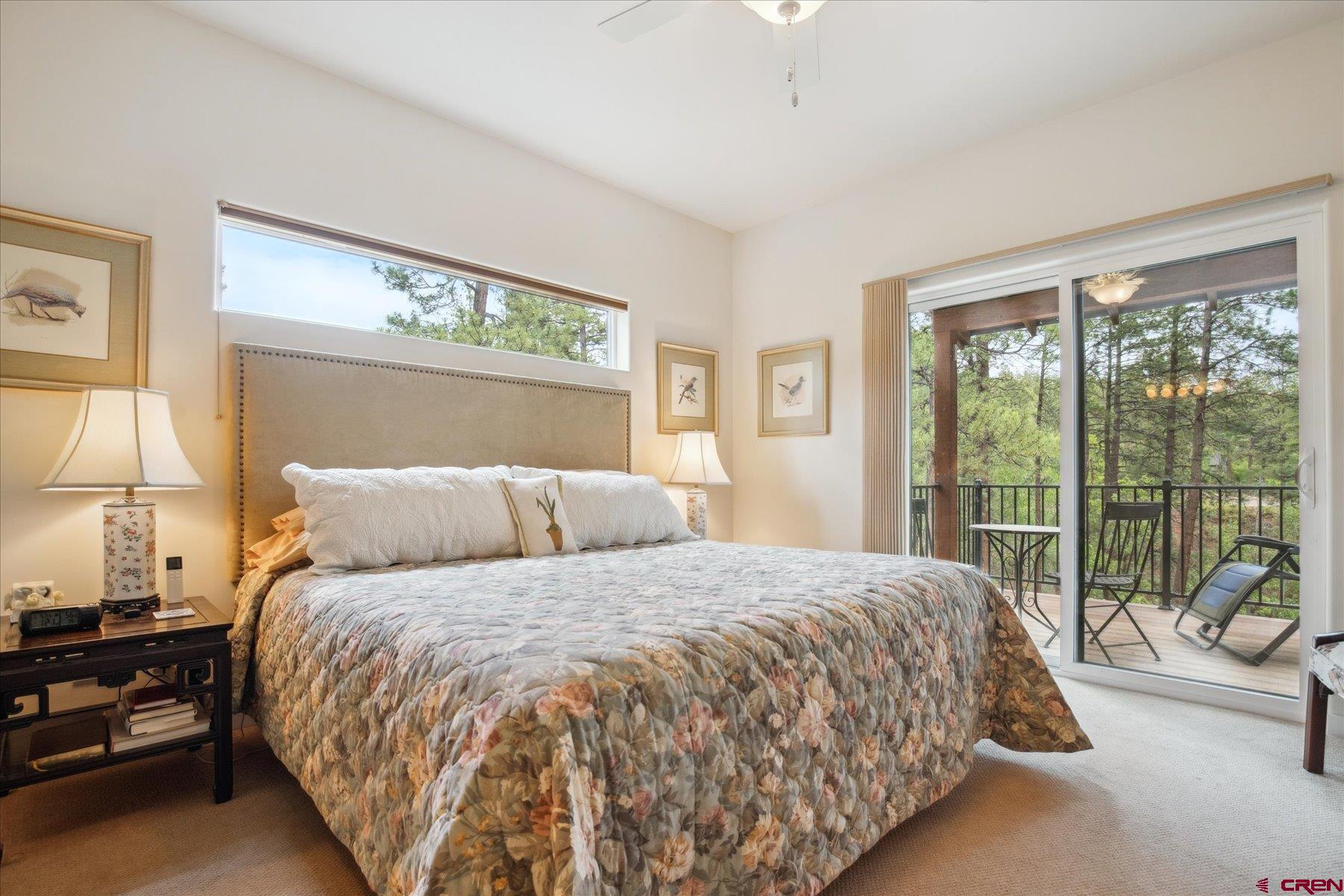 152 Red Canyon Trail, Unit R Durango, CO 81301 - Photo 16 of 42 a bed sitting in a bedroom next to a window