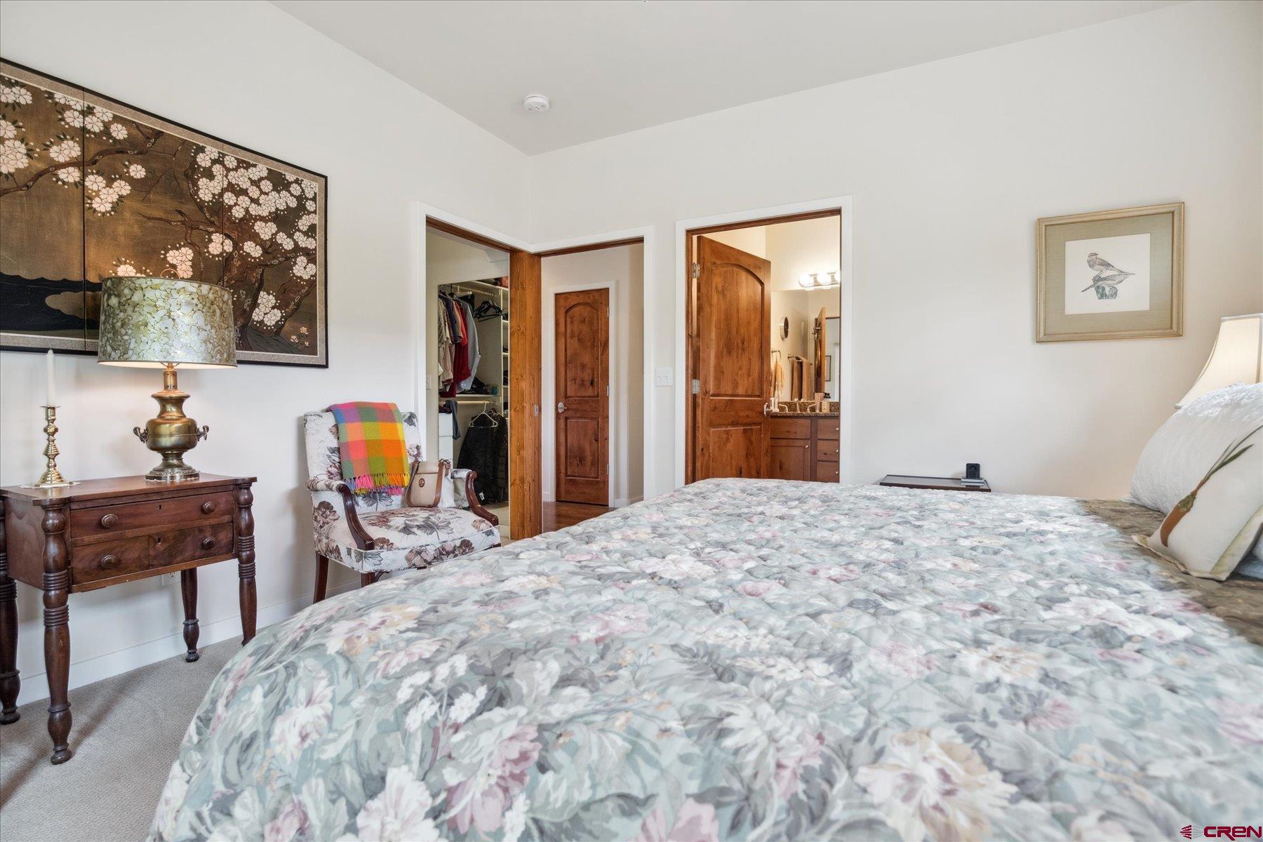 152 Red Canyon Trail, Unit R Durango, CO 81301 - Photo 17 of 42 a bedroom with a bed and a table in it