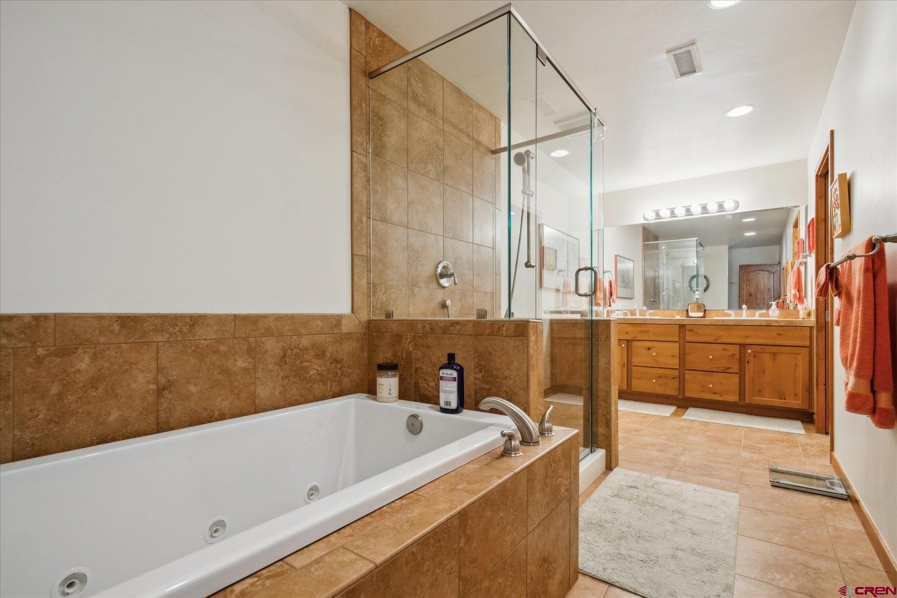 152 Red Canyon Trail, Unit R Durango, CO 81301 - Photo 28 of 42 a bathroom with a bathtub and a sink