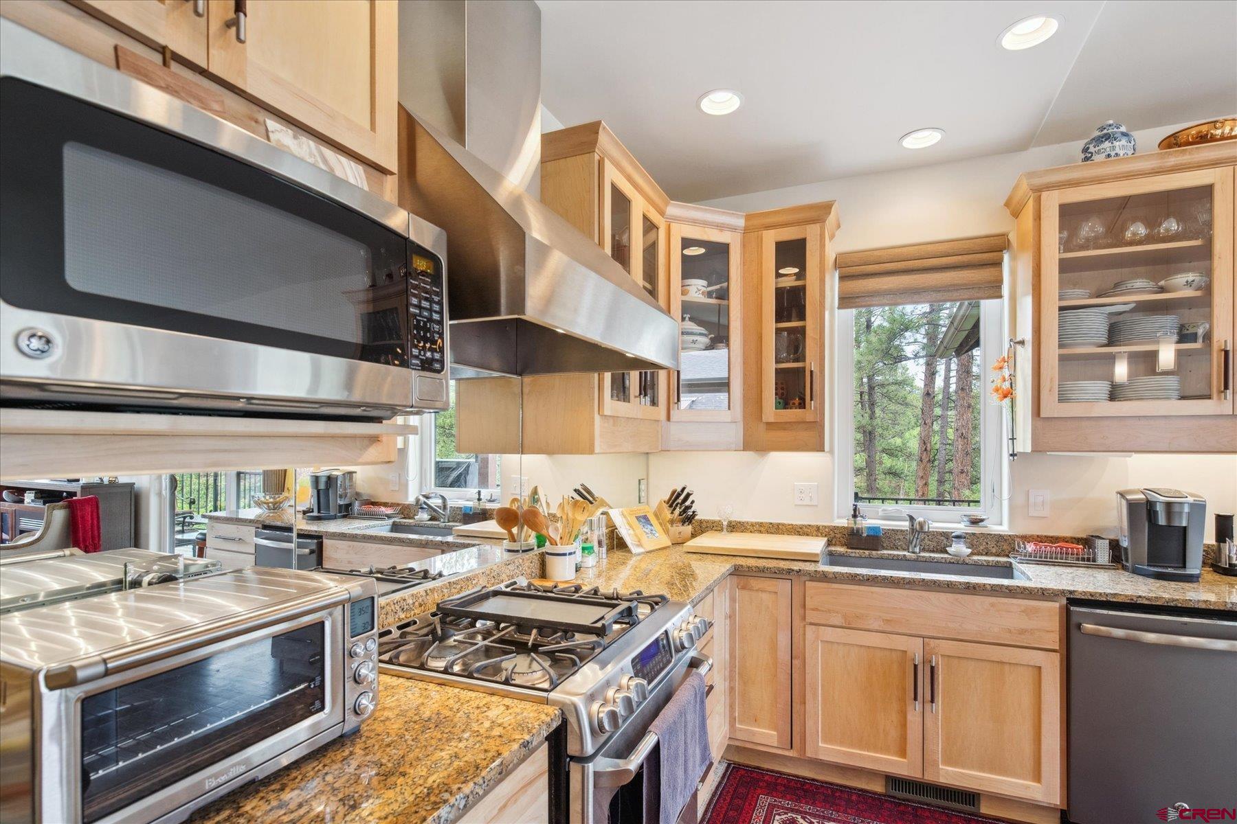 152 Red Canyon Trail, Unit R Durango, CO 81301 - Photo 6 of 42 a kitchen with stainless steel appliances granite countertop a stove and a sink