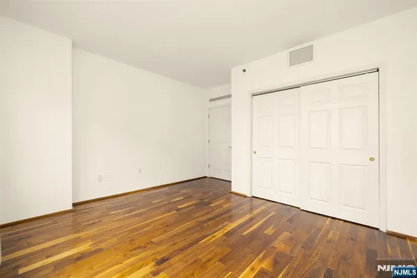 an empty room with wooden floor