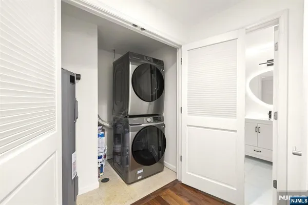 a view of a hallway with washer and dryer