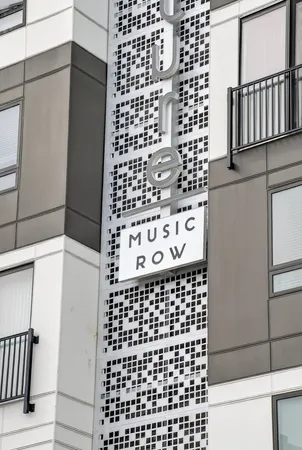 a bathroom with a black white checkered floor