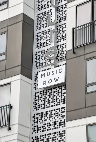 a bathroom with a black white checkered floor