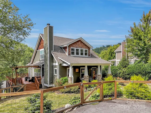 a front view of a house with sitting area