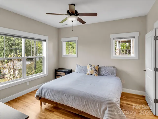 a bedroom with a large bed and a window