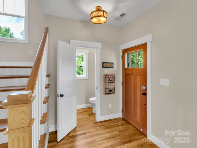 a view of an entryway with wooden floor