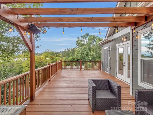 a view of a lush green space with a mountain in the background