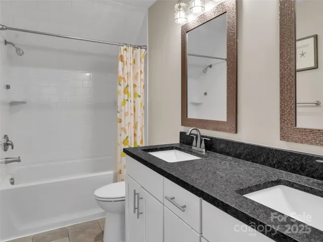 a kitchen with a refrigerator and a stove top oven