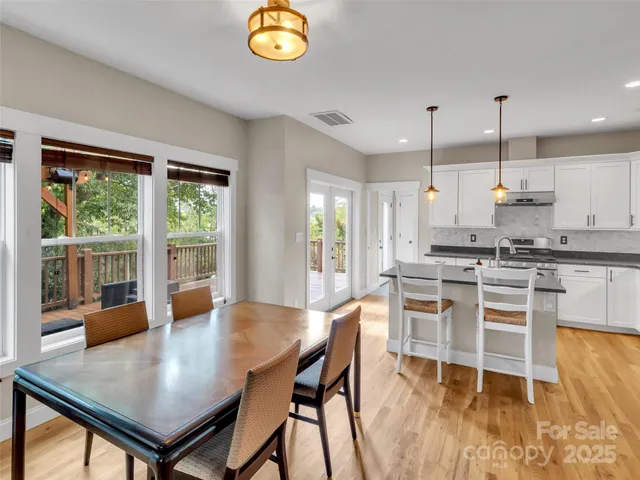 a open kitchen with a table and chairs in it