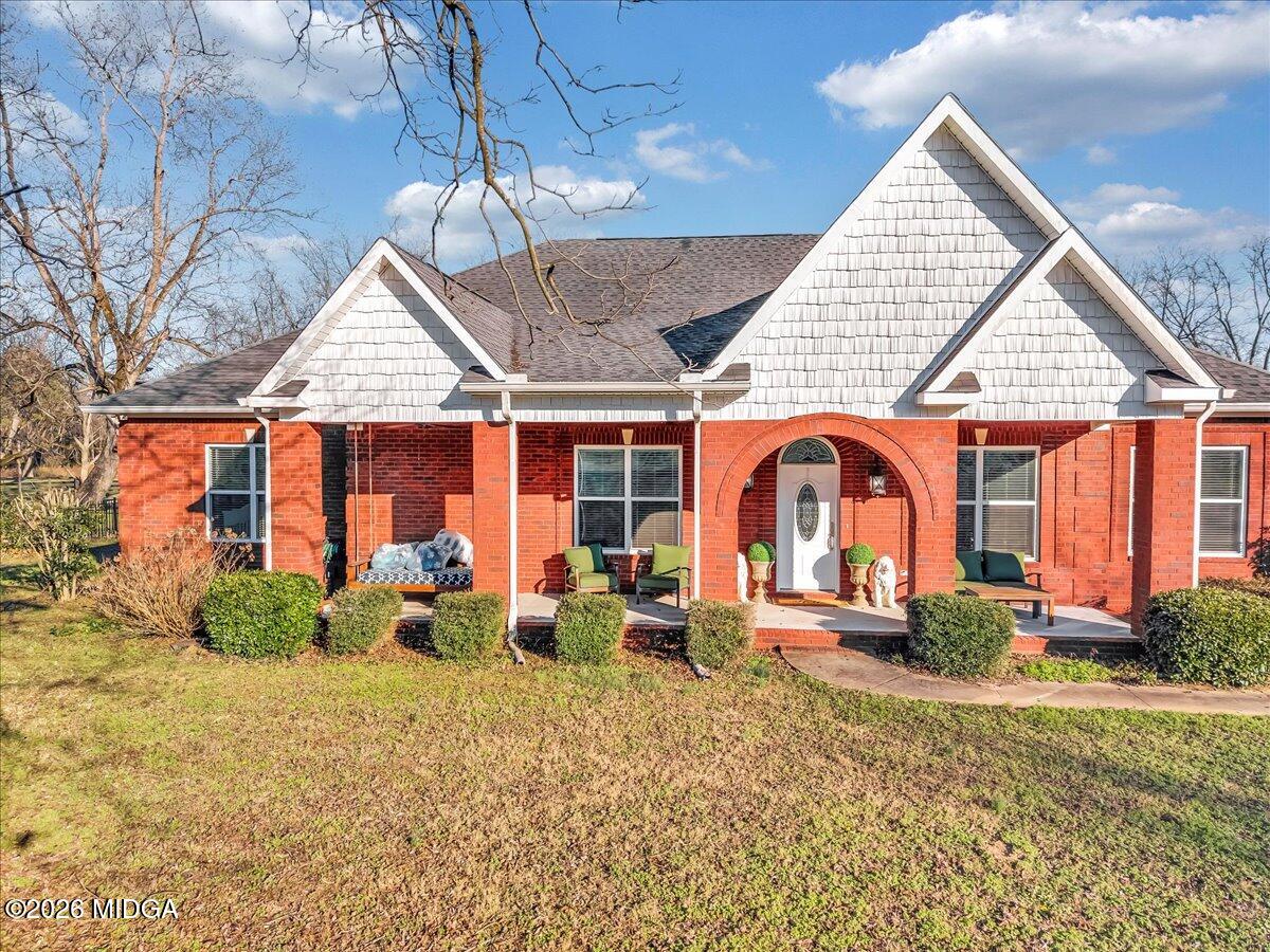 a front view of house with outdoor seating