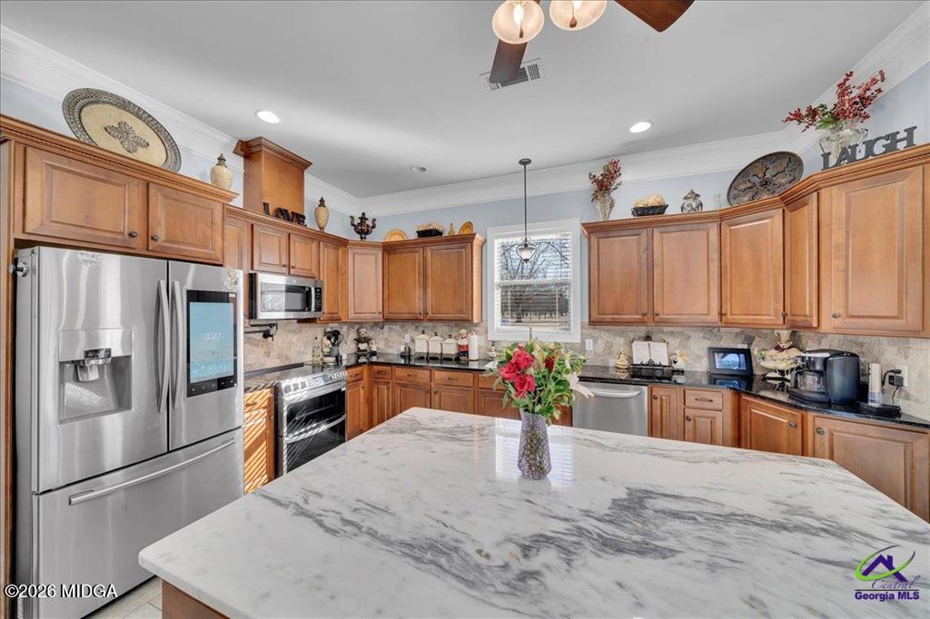 706 Orr Road Fort Valley, GA 31030 - Photo 13 of 50 a kitchen with granite countertop a refrigerator stove top oven and sink