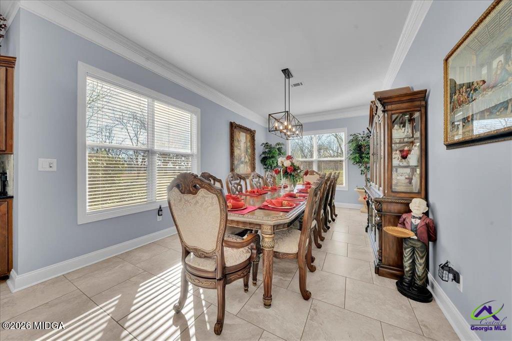 706 Orr Road Fort Valley, GA 31030 - Photo 14 of 50 a dining room with furniture a livingroom and chandelier