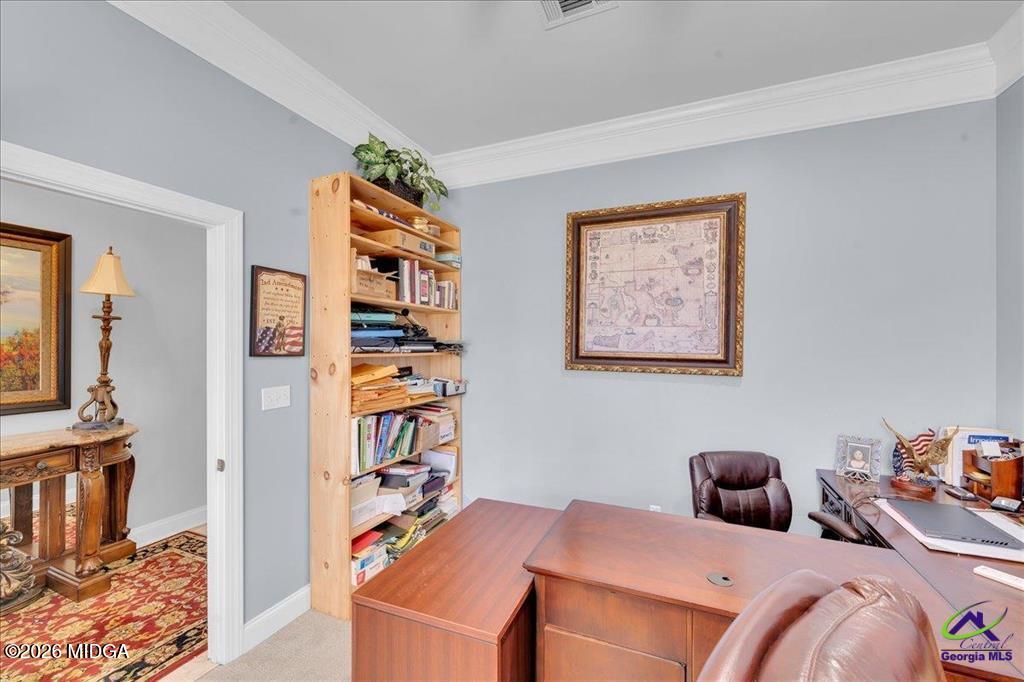 706 Orr Road Fort Valley, GA 31030 - Photo 18 of 50 a bedroom with a bed and a book shelf