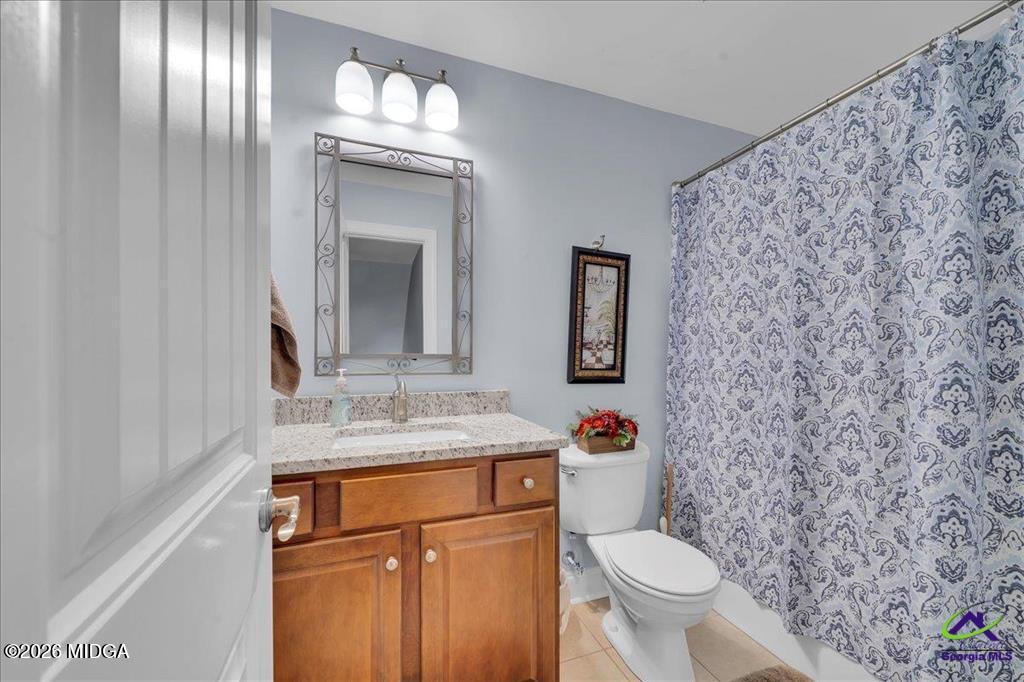 706 Orr Road Fort Valley, GA 31030 - Photo 22 of 50 a bathroom with a granite countertop toilet sink and mirror