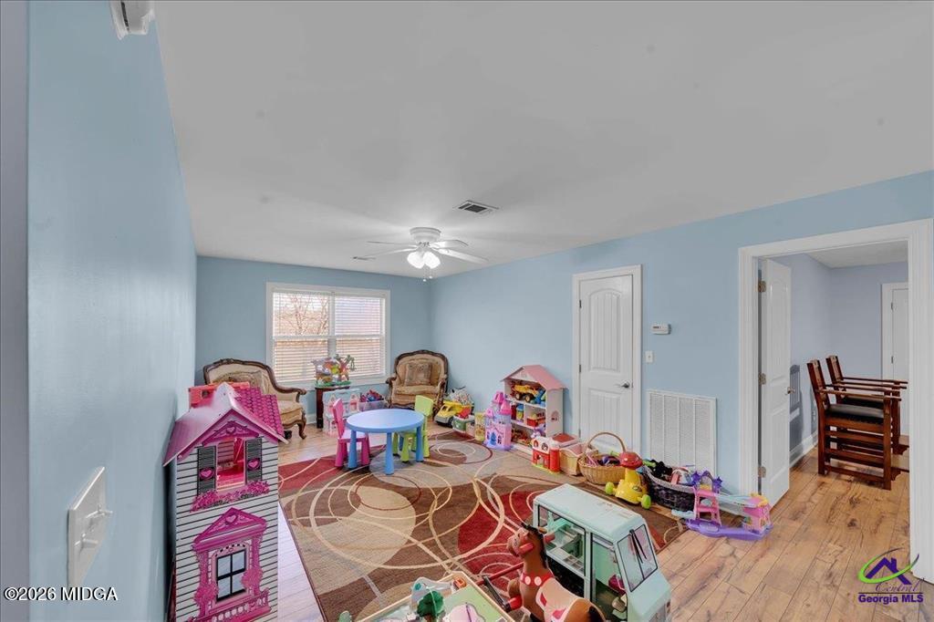 706 Orr Road Fort Valley, GA 31030 - Photo 23 of 50 a living room filled with furniture and a wooden floor