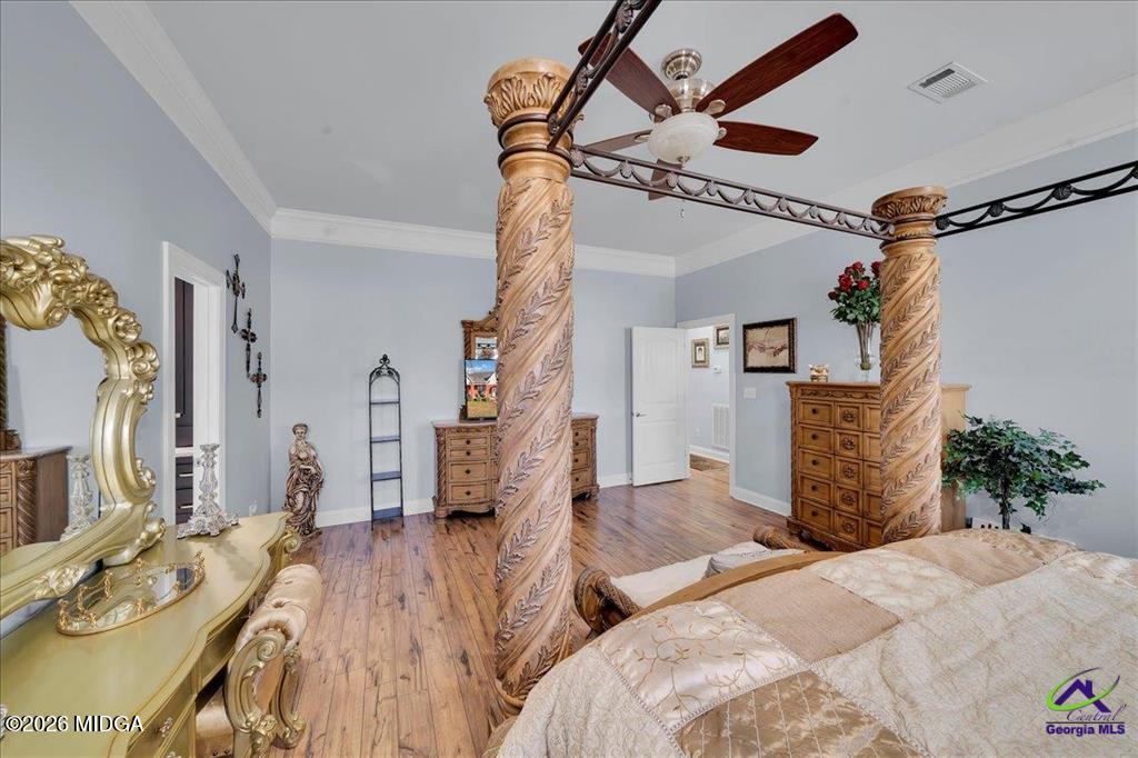 706 Orr Road Fort Valley, GA 31030 - Photo 30 of 50 a bedroom with furniture and a wooden floor