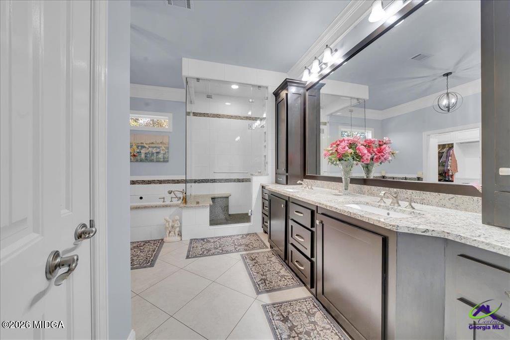 706 Orr Road Fort Valley, GA 31030 - Photo 31 of 50 a bathroom with a granite countertop sink a mirror and a shower