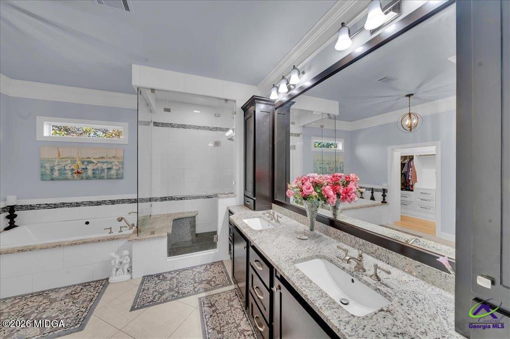 706 Orr Road Fort Valley, GA 31030 - Photo 37 of 50 a bathroom with a granite countertop sink a large mirror and shower