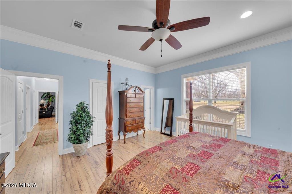 706 Orr Road Fort Valley, GA 31030 - Photo 39 of 50 a bedroom with furniture and a large window